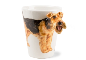 The Welsh Terrier lovingly depicted on our Blue Witch ceramic has existed in Wales since the 1800's. They originated from the Old English black and tan Terrier that existed in England as early as the 13th century. Loved the world over as a vigorous family pet.