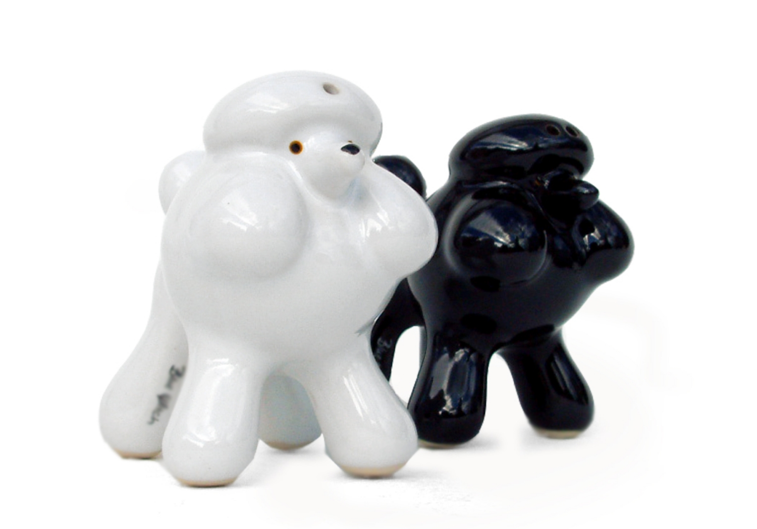 Known for its charisma and intelligence, making it a widespread family pet around the world. The super posh Poodle is depicted gorgeously on this ceramic salt and pepper cruet set!