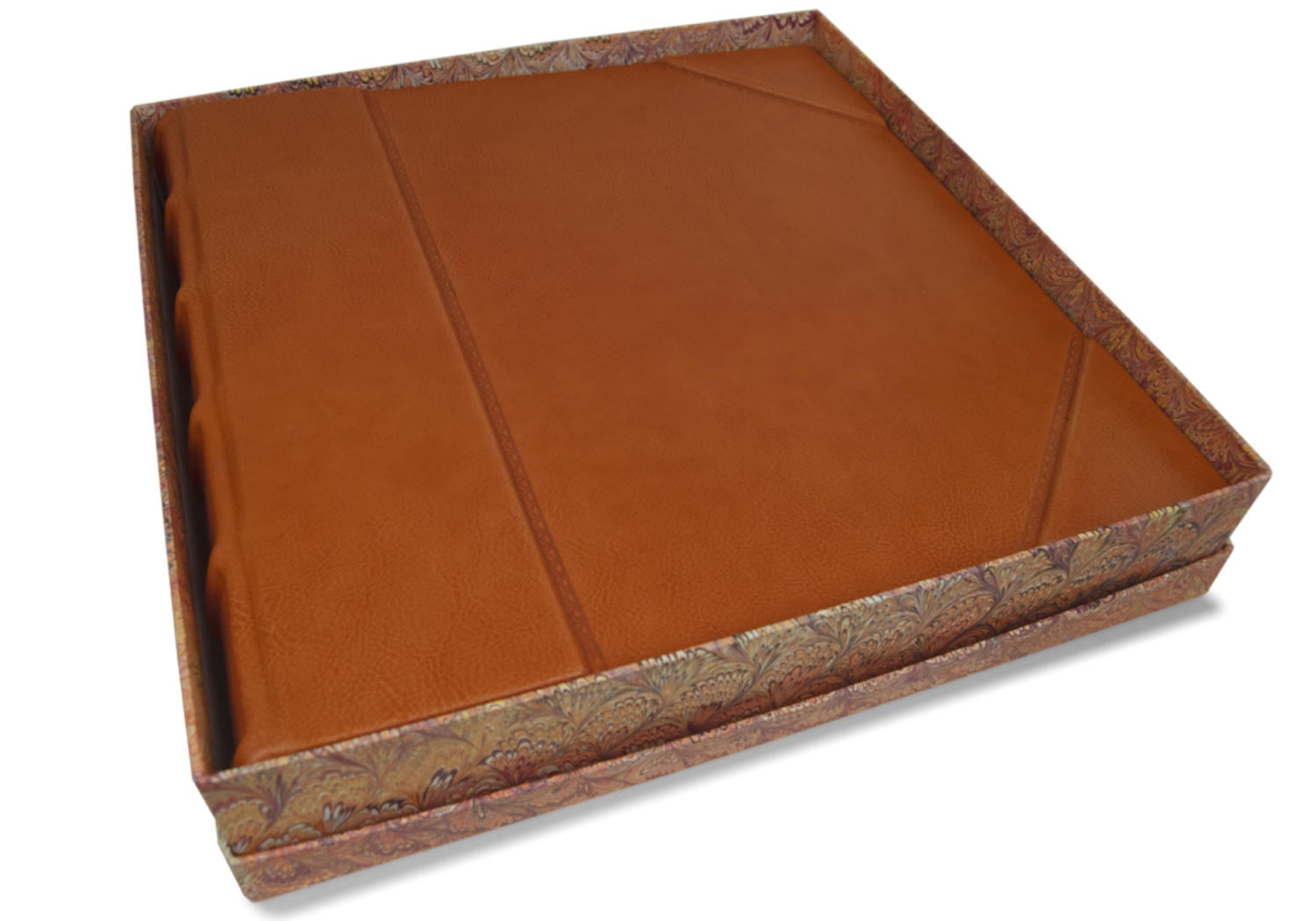 A declaration of unrivalled quality: the Sicilian Photo Album is an Italian Aristocratic design featuring intricate Tuscan craftsmanship. It is exquisitely handmade from the most exquisite and immaculate skins, known as full-grain leather hides.  This matchless leather is painstakingly tanned by Italian leather craftsmen using the world’s most environmentally friendly tanning method which utilizes vegetable dyes. This pioneering process can only be used on the finest hides as it does not disguise flaws but instead illuminates the leather’s natural lustrous grain.The robust structure is created using the adept art form of book binding and features a rigid ribbed arched spine. A sophisticated hand embossed design creates a stately impression and conveys an evocative warmth curtesy of the subtle tones of the leather.