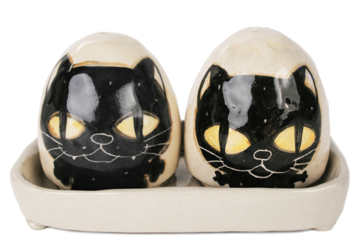 An eye catching feline takes the starring role on our Blue Witch Coraline ceramic collection.Each Cruet Set is ingeniously hand illustrated by a prolific artist. The canny brush strokes and cunning design create a curiosity with an air of mystery. Each piece is hand tooled to form a slightly eccentric asymmetrical shape. Visually and audibly theatrical whilst great for everyday use, dishwasher safe and microwave friendly to guarantee the colour will never fade.  It will also add a magical charm to a dinner party. Guaranteed to make the kids ‘Meow’ with delight and full of joie de vivre at any fun theme party!