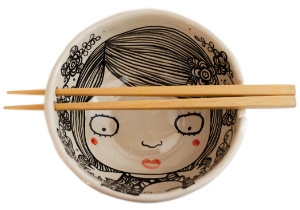 Quirky, imaginative and incisive. The Blue Witch Shojo collection is sensationally hand illustrated by a prolific artist inspired by Japanese anime.  Confident and witty with free form flawless brush strokes in striking monochrome. Each piece is hand tooled to create a slightly eccentric asymmetrical shape.This charismatic Shojo ceramic Bowl is fab for daily use, dishwasher safe and microwave friendly to guarantee the colour will never fade. A perfect piece for adding a vivid aura on your table top.