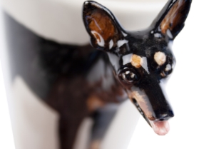Known as the 'min pin', and 'King of the toy dogs'. The Miniature Pinscher is not  a miniature Doberman, it is actually a far older breed, which was first bred to hunt vermin. Wonderfully presented on a Blue Witch ceramic.