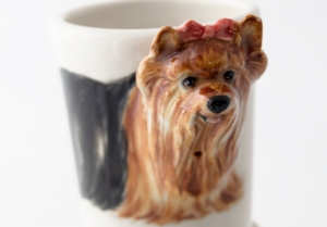 A pretty Blue Witch ceramic depicting the courageous and spirited Yorkshire Terrier. This feisty little breed hails from the north of England and is a working dog bred specifically for hunting vermin in factories.