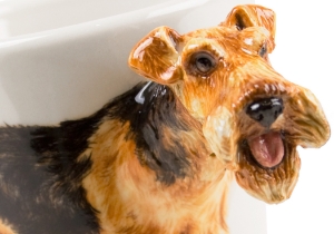 The Welsh Terrier lovingly depicted on our Blue Witch ceramic has existed in Wales since the 1800's. They originated from the Old English black and tan Terrier that existed in England as early as the 13th century. Loved the world over as a vigorous family pet.