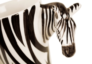 The Zebra is such a distinctive looking beast with its stunning black and white stripes. They are closely related to the horse, but unlike his cousin likes to wear his mane in a fetching Mohican! Strikingly beautiful on our Blue Witch ceramic.