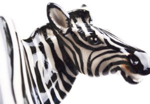 The Zebra is such a distinctive looking beast with its stunning black and white stripes. They are closely related to the horse, but unlike his cousin likes to wear his mane in a fetching Mohican! Strikingly beautiful on our Blue Witch ceramic.
