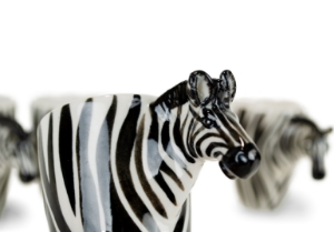 The Zebra is such a distinctive looking beast with its stunning black and white stripes. They are closely related to the horse, but unlike his cousin likes to wear his mane in a fetching Mohican! Strikingly beautiful on our Blue Witch ceramic.