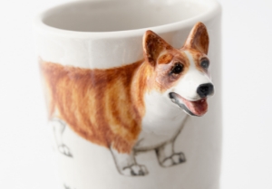 It is believed the Welsh Corgi is descended from Viking herding dogs. Known to be the pets of the English Monarchy they are said to make excellent companions. This lovely little dog is portrayed on a delectable ceramic by Blue Witch.