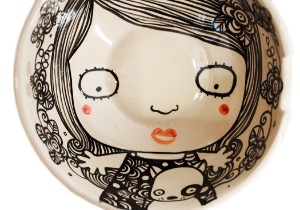 Quirky, imaginative and incisive. The Blue Witch Shojo collection is sensationally hand illustrated by a prolific artist inspired by Japanese anime.  Confident and witty with free form flawless brush strokes in striking monochrome. Each piece is hand tooled to create a slightly eccentric asymmetrical shape.This charismatic Shojo ceramic Bowl is fab for daily use, dishwasher safe and microwave friendly to guarantee the colour will never fade. A perfect piece for adding a vivid aura on your table top.