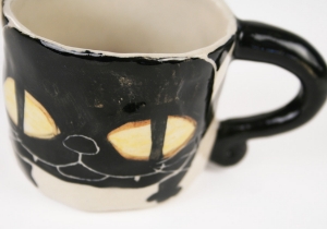 An eye catching feline takes the starring role on our Blue Witch Coraline ceramic collection.Each Espresso Cup is ingeniously hand illustrated by a prolific artist. The canny brush strokes and cunning design create a curiosity with an air of mystery. Each piece is hand tooled to form a slightly eccentric asymmetrical shape. Visually and audibly theatrical whilst great for everyday use, dishwasher safe and microwave friendly to guarantee the colour will never fade.  It will also add a magical charm to a dinner party. Guaranteed to make the kids ‘Meow’ with delight and full of joie de vivre at any fun theme party!